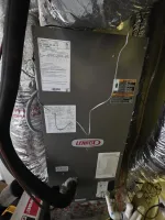 Residential HVAC Repair in Dunwoody 30338 by The Air Company of GA. Pressures are low on unit.  Lennox HVAC air handler unit installed with insulated ductwork and labeled service information.