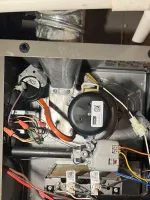 Furnace Heating Repair in Alpharetta 30009 by The Air Company of GA.  Interior of an HVAC furnace showing wiring, ignition control, blower motor, and gas valve components.