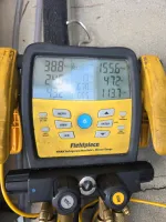 Wine Cellar Repair in Marietta 30064 by The Air Company of GA.  Fieldpiece SMAN refrigerant manifold gauge showing pressure and temperature readings for HVAC system.