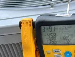 HVAC Repair in Sandy Springs 30328 by The Air Company of GA.  Digital Fieldpiece HVAC manifold gauge displaying refrigerant pressure and temperature readings on yellow and black device.