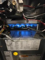 Heating Furnace Repair Marietta 30066 by The Air Company of GA.  Blue flame burners inside a gas furnace showing internal components and wiring with control labels.