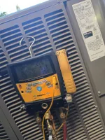 Residential HVAC Repair in Dunwoody 30338 by The Air Company of GA. Pressures are low on unit.  Fieldpiece digital manifold gauge connected to a Lennox HVAC unit showing pressure and temperature readings.