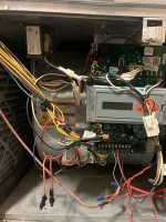 Heating Furnace Repair in Brookhaven Atlanta 30319 by The Air Company of GA.  Open electrical panel showing circuit boards, wiring, and connectors inside a HVAC unit enclosure.
