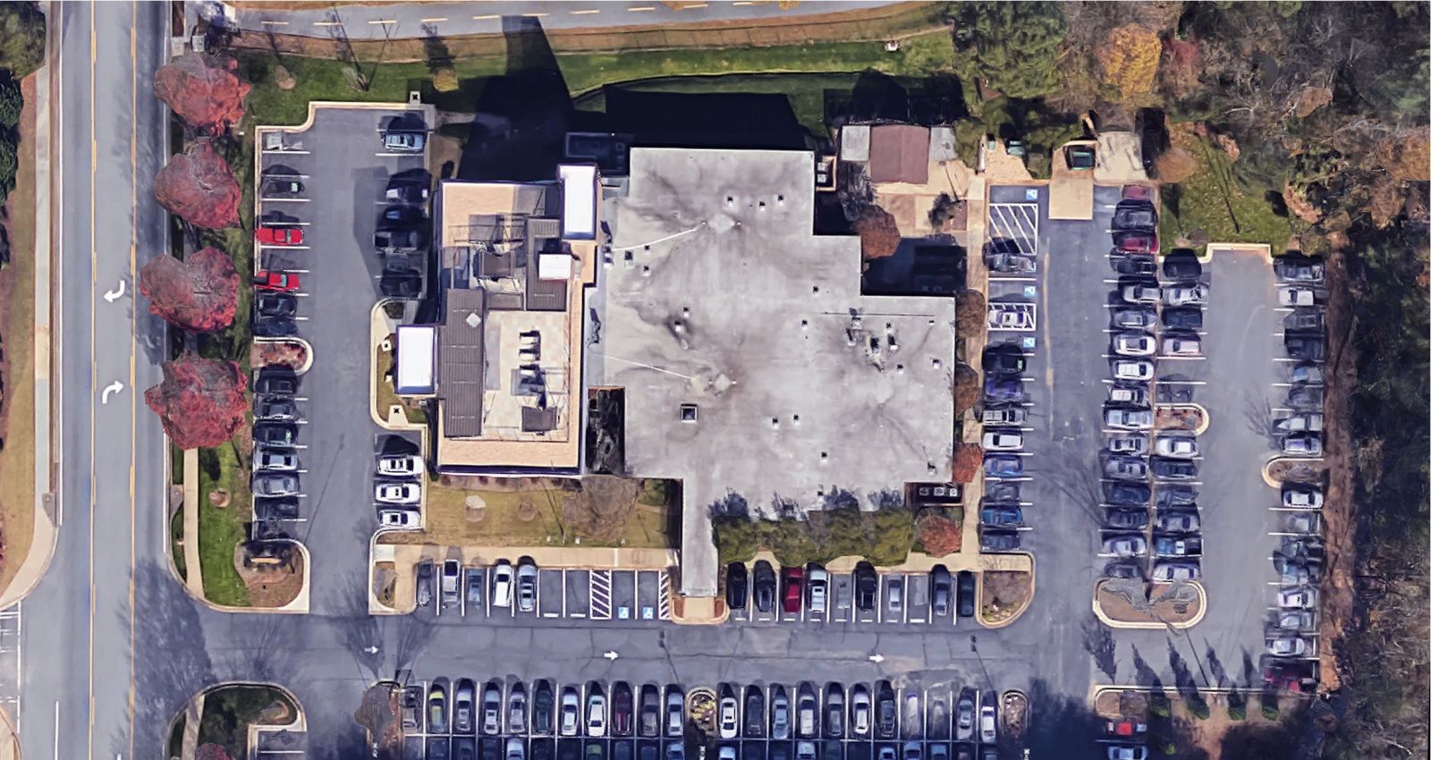 Perspective view of business building and parking lot to find water lines, sewers, and other underground utilities