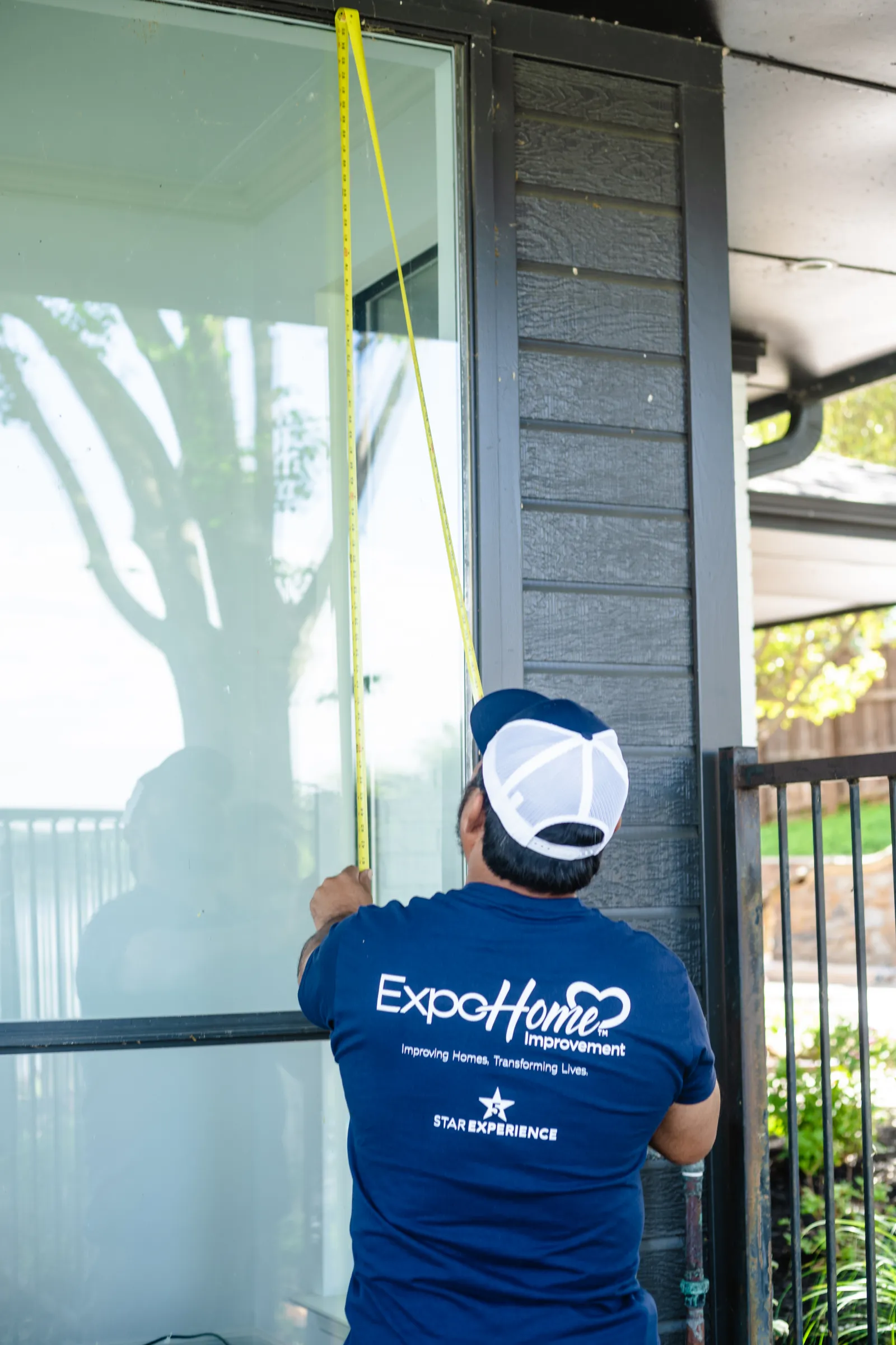 Man measuring custom windows