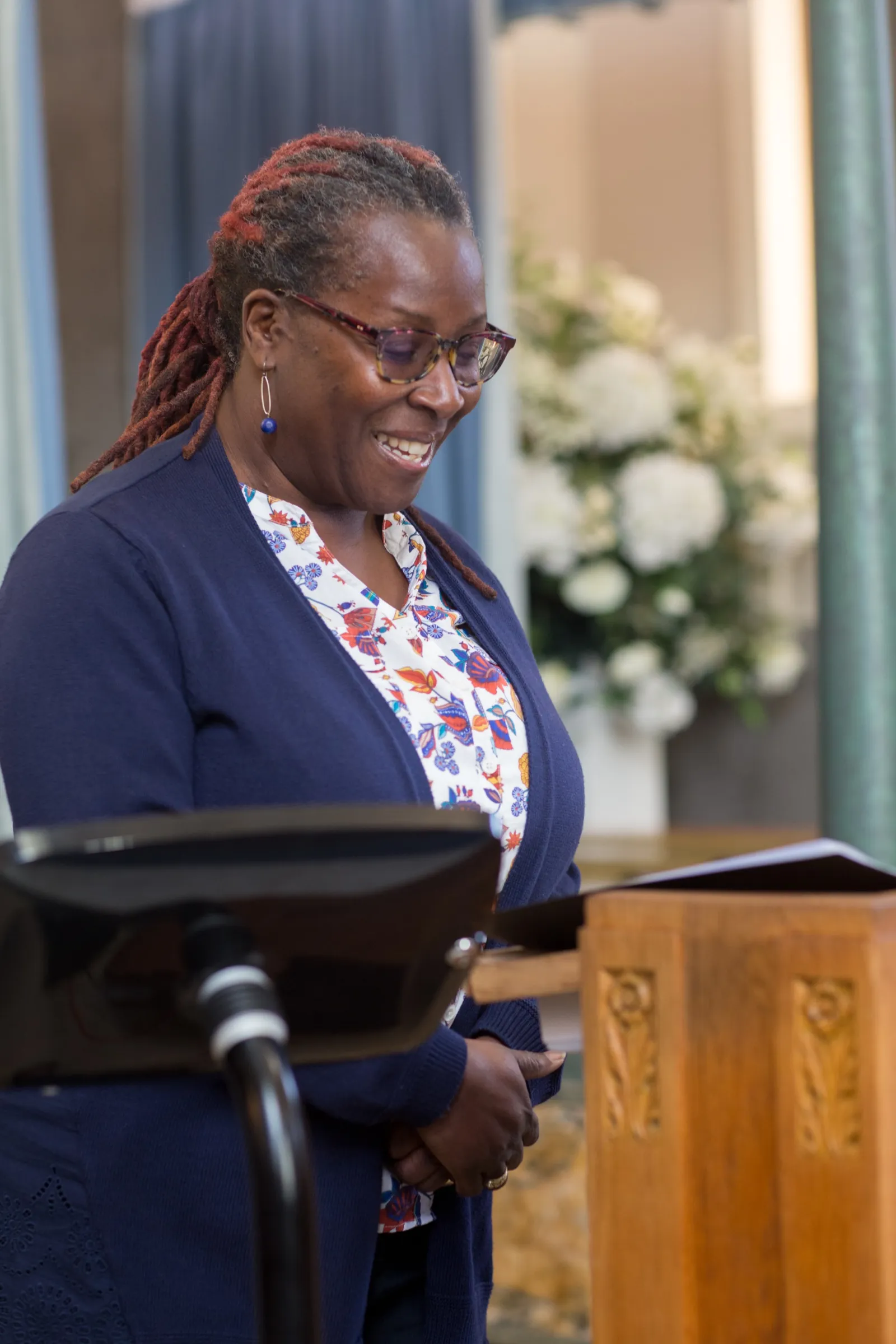 Woman reading scripture at Catholic Funeral