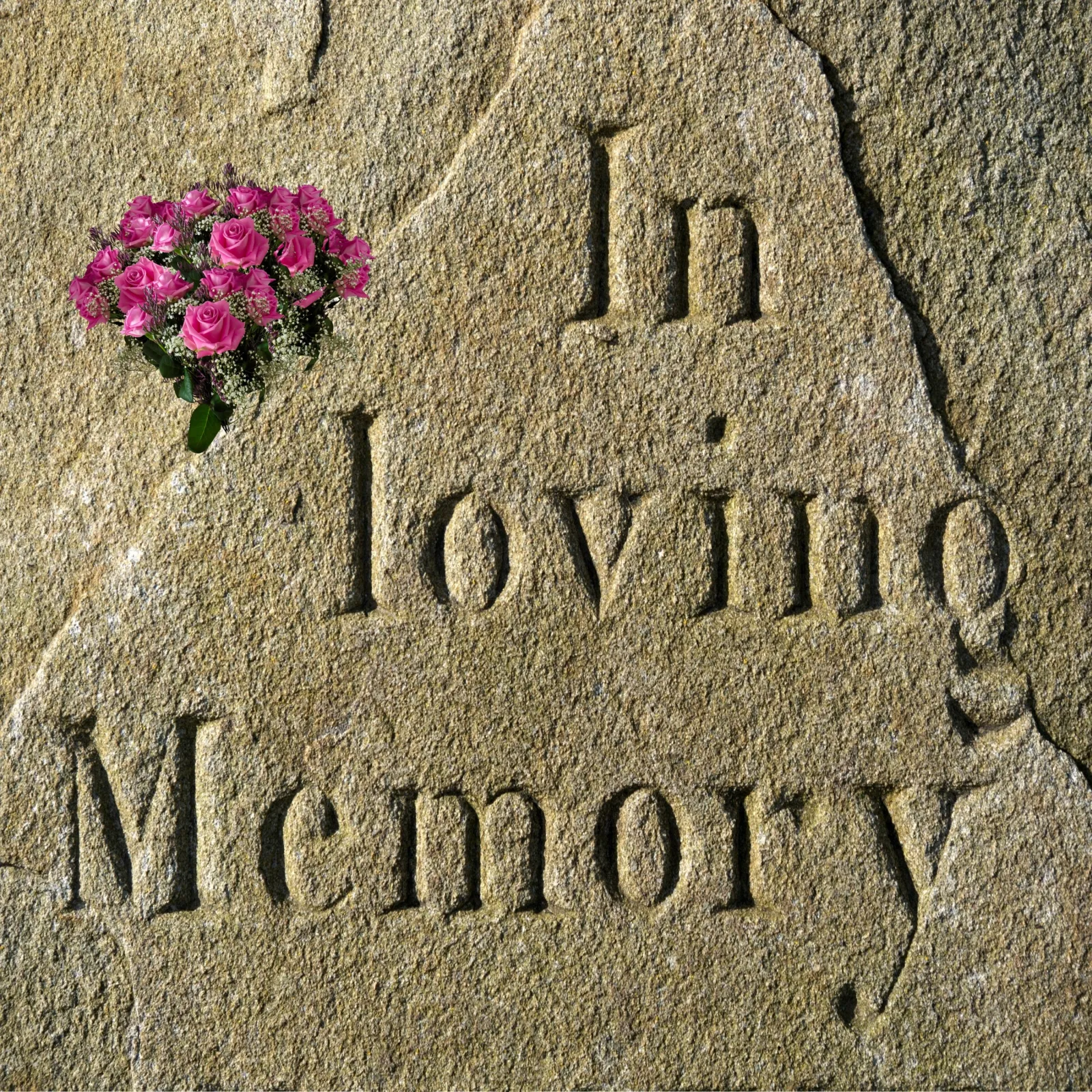 In loving memory engraved on grave stone