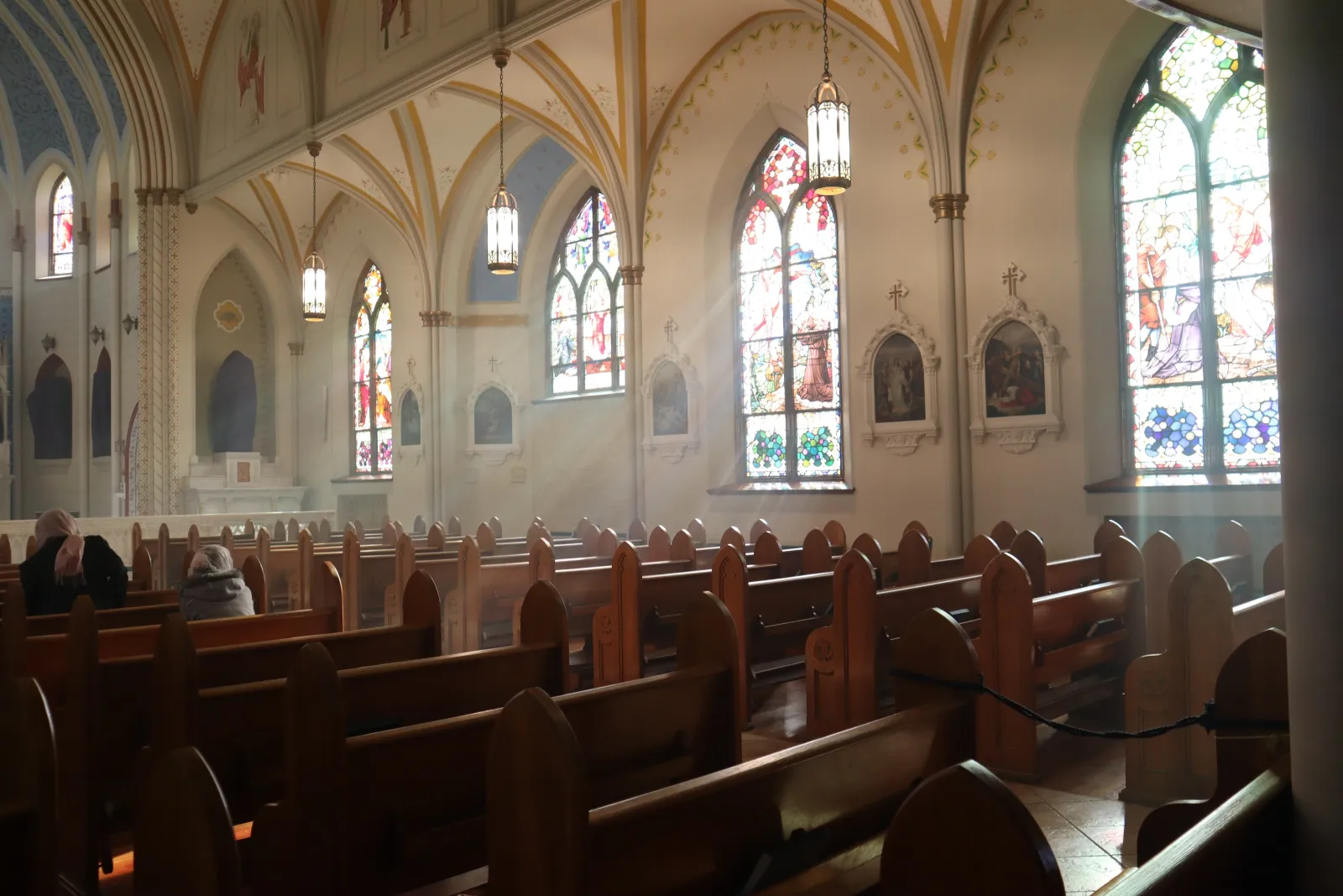 Roman Catholic Church with light pearing through windows