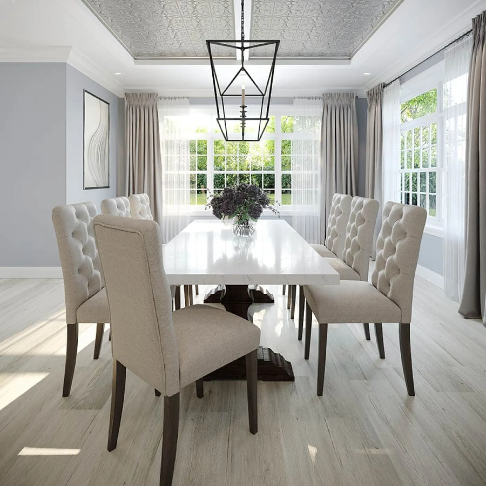 Bright dining room with a white marble table, beige tufted chairs, large windows, and modern pendant light.