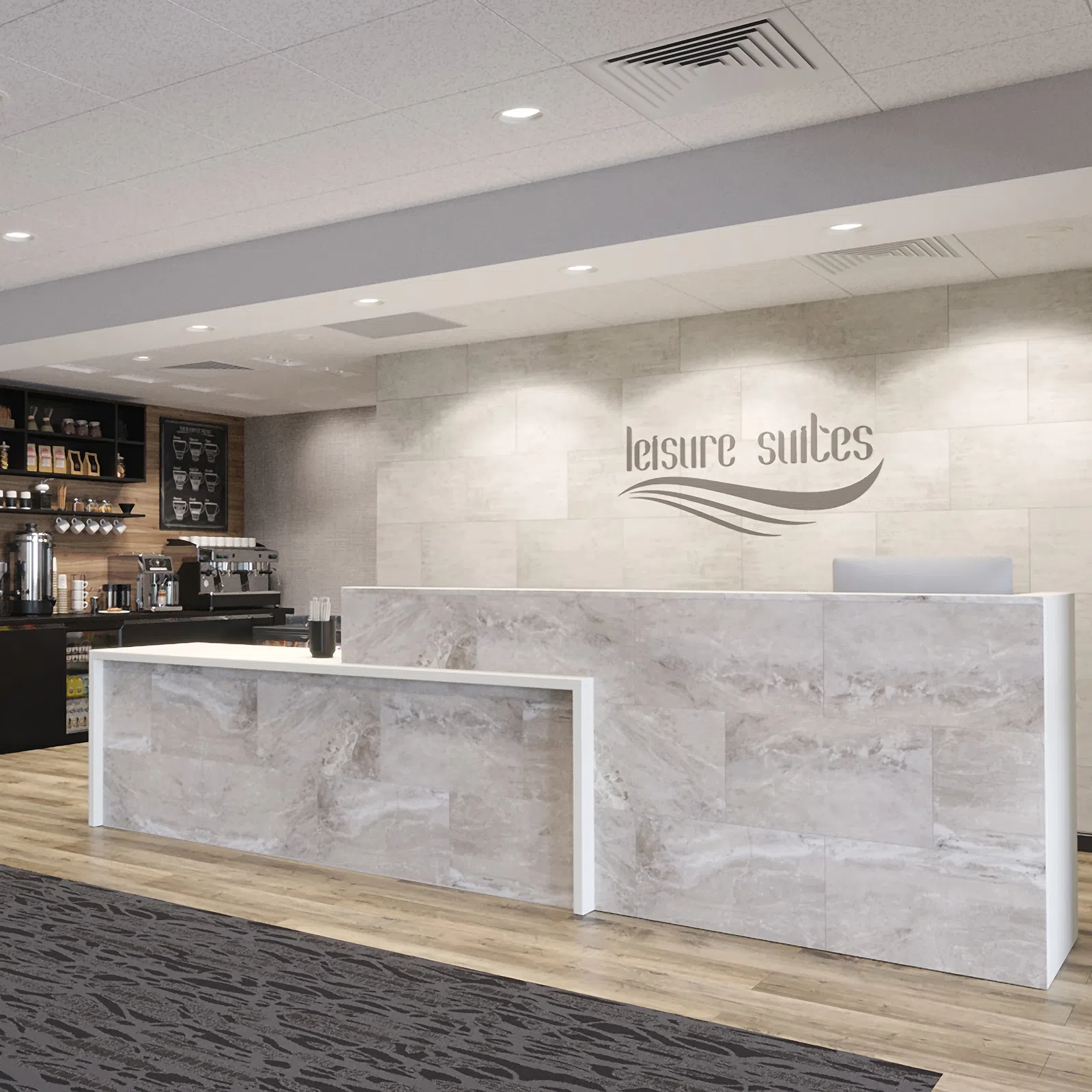 Modern hotel reception desk with marble finish and coffee bar in the background under recessed lighting.