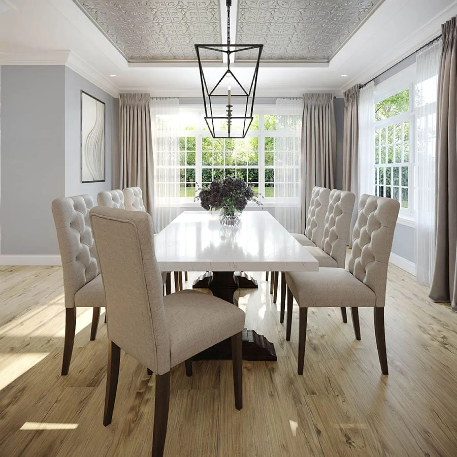 Bright dining room with large windows, beige tufted chairs, a white table, wooden floor, and decorative pendant light.