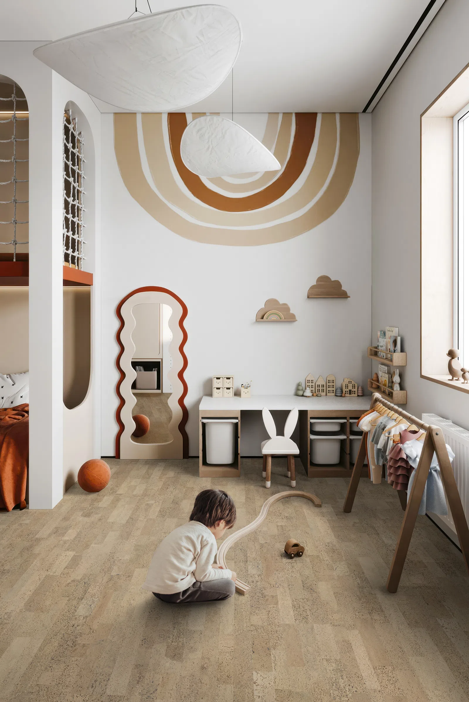 Child playing with wooden train on the floor in a modern, neutral-toned kids' room with playful decor and natural light.