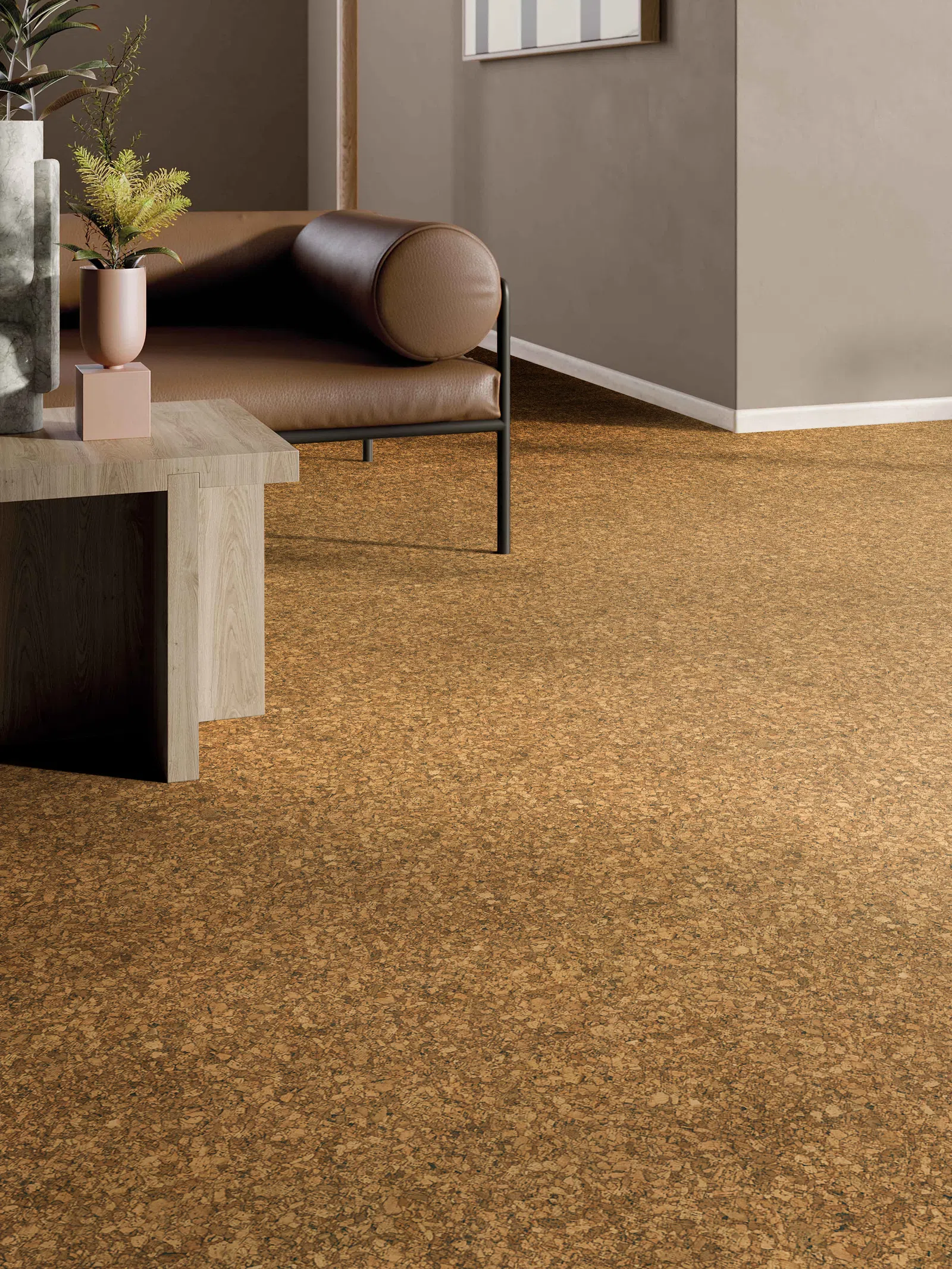 Modern living room with cork flooring, brown leather sofa, wooden side table, and decorative plants.