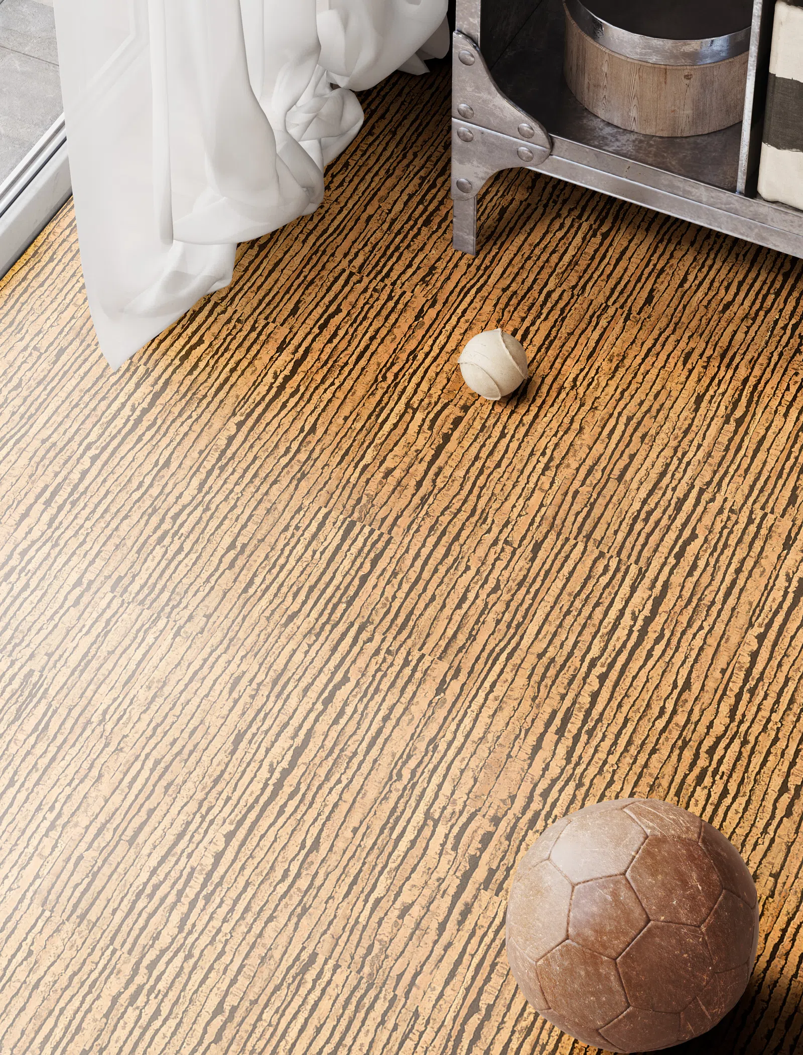 Textured wooden floor with two vintage sports balls near a metal shelf and white curtain by glass door.