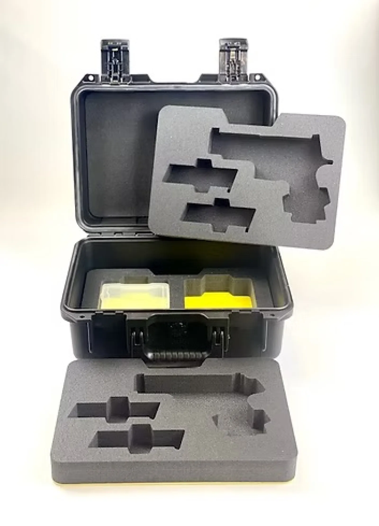 Black protective case with custom foam inserts designed to hold specific tools or equipment securely.