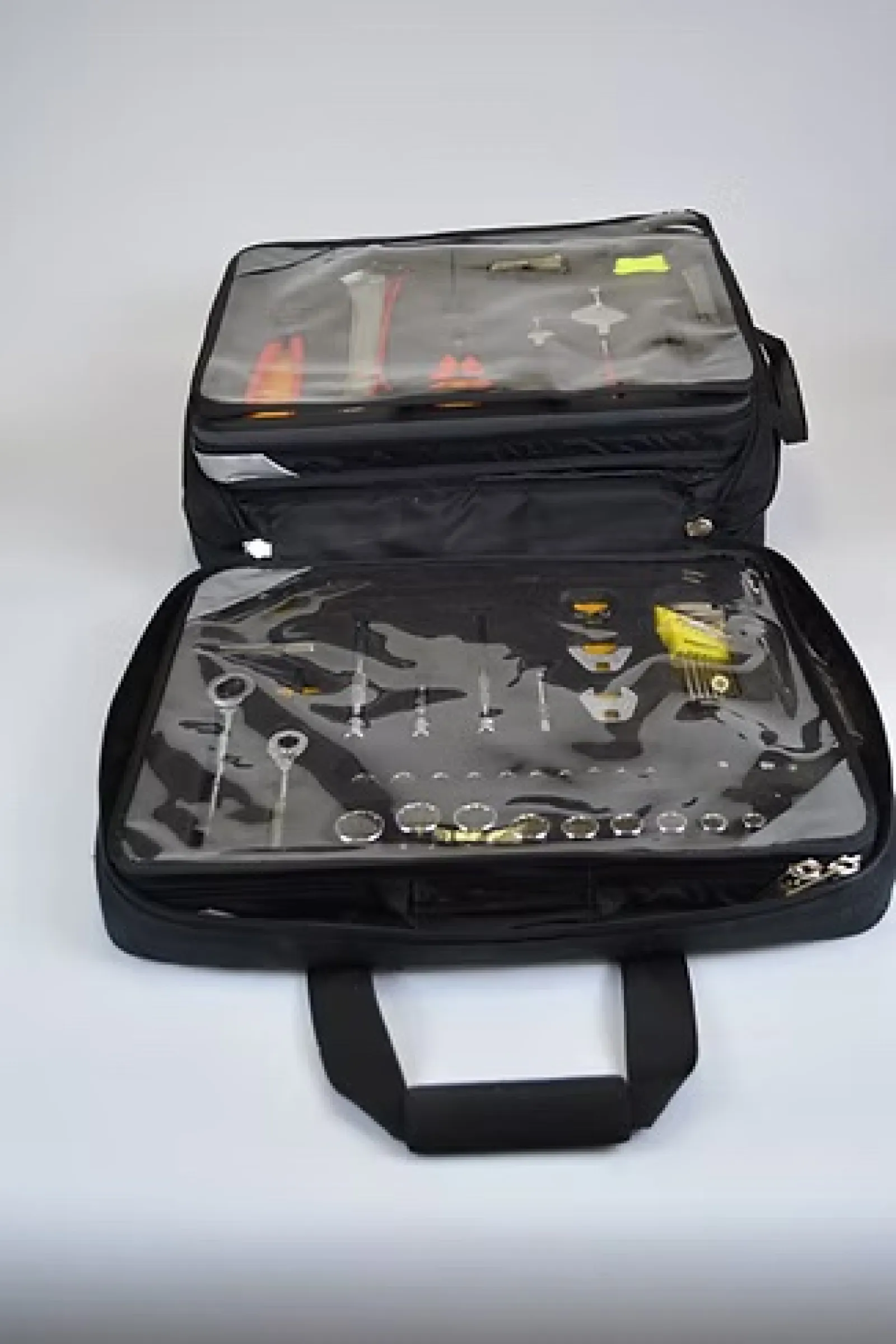 Black tool case with transparent covers displaying assorted hand tools like wrenches and screwdrivers organized inside.