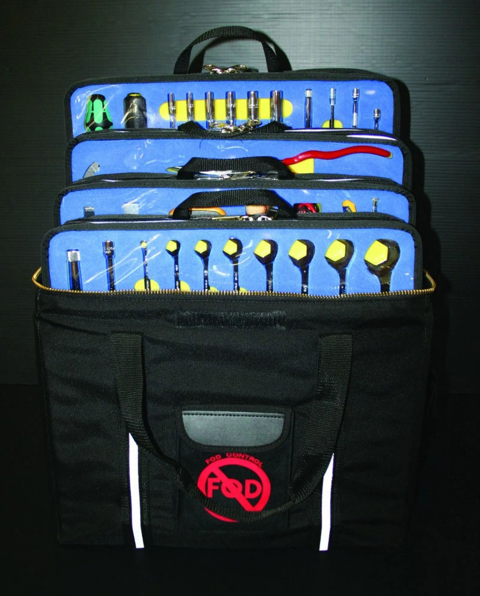Open black tool bag displaying organized wrenches, pliers, screwdrivers, and sockets with blue tool holders.
