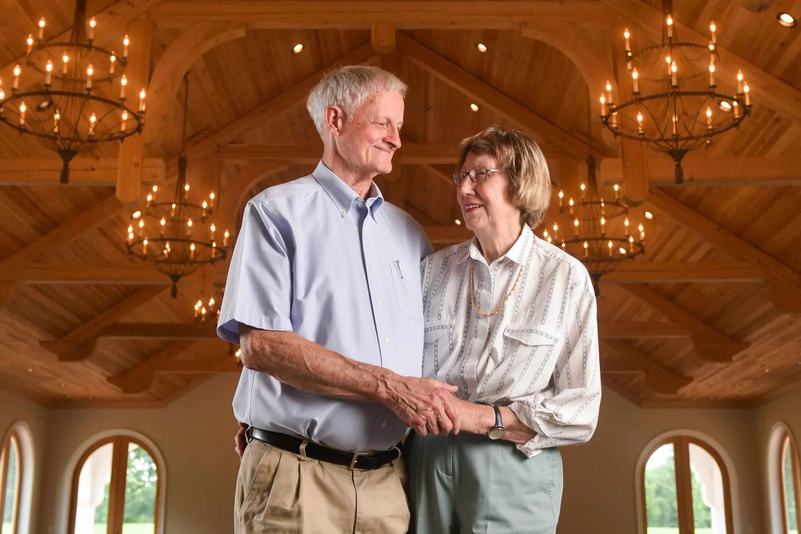 Berry couple hug in Oak Hill Pavilion