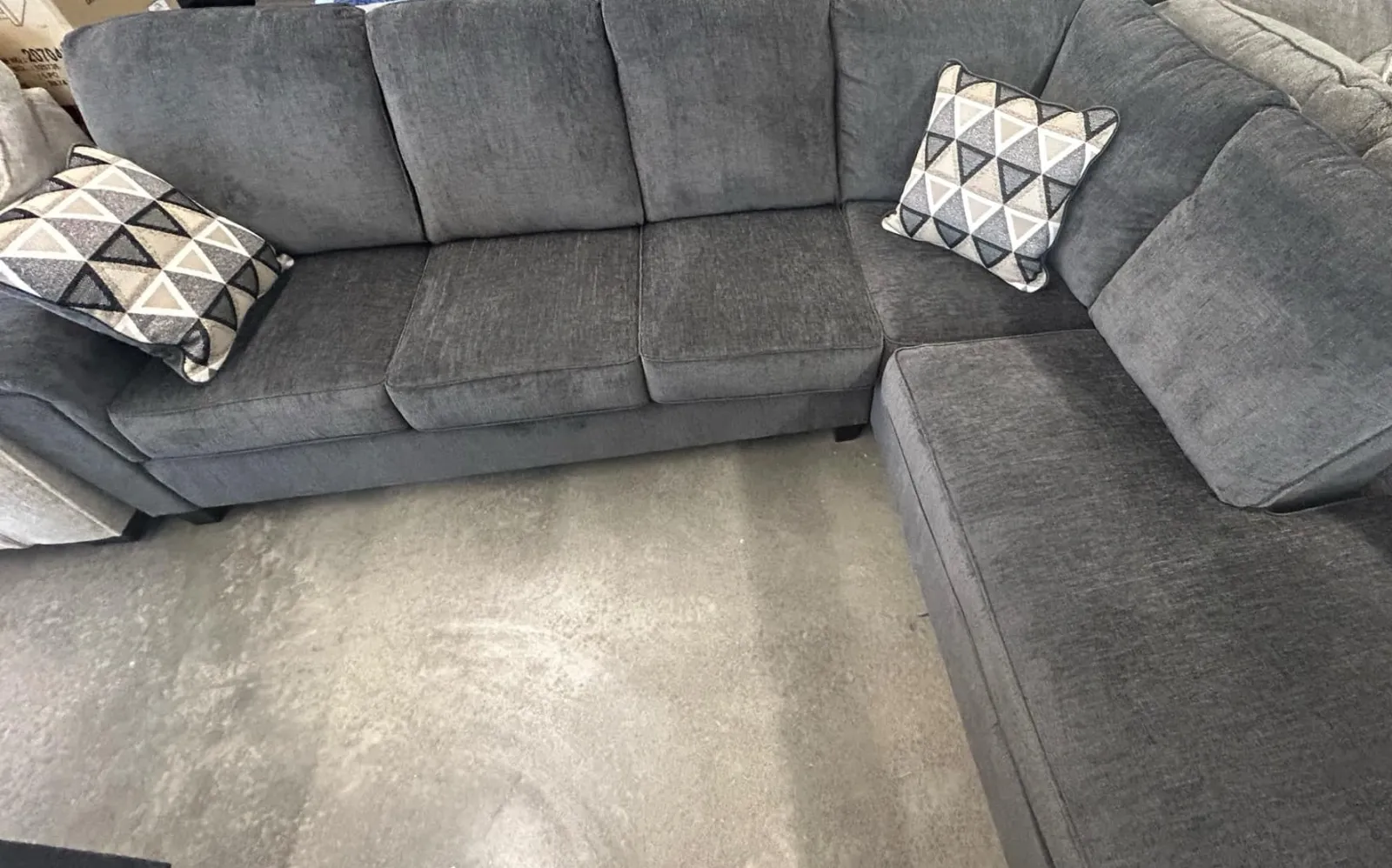 a group of grey couches