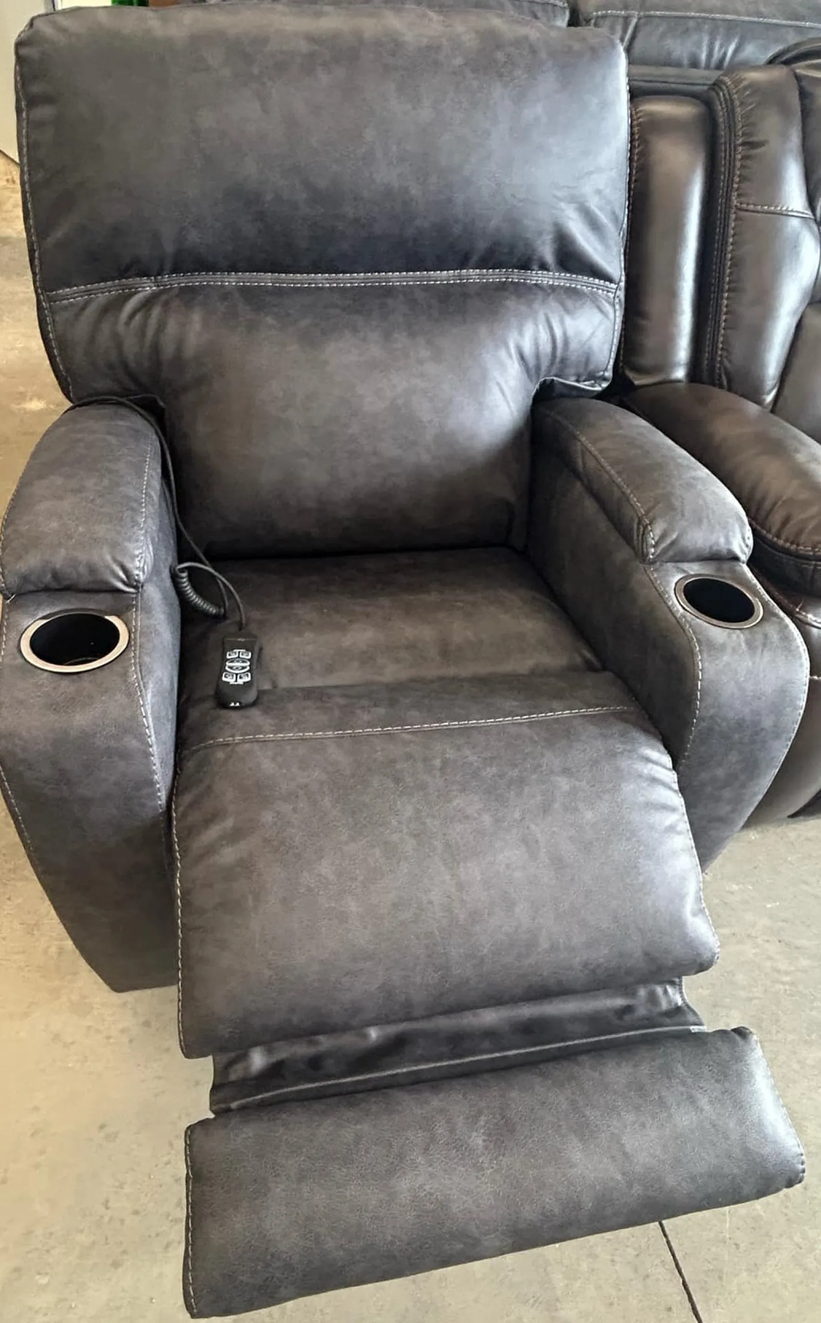 a pair of black leather chairs