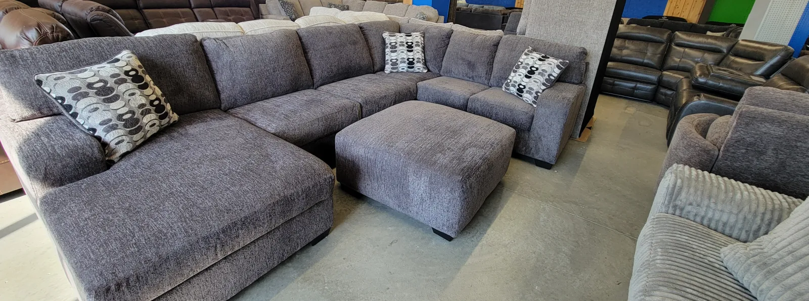 a group of grey couches