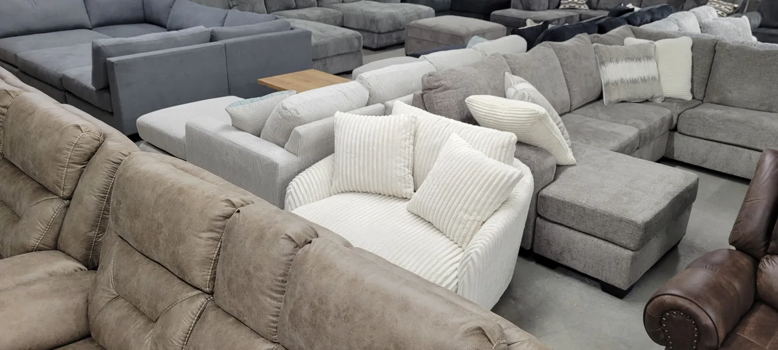 a large group of grey couches