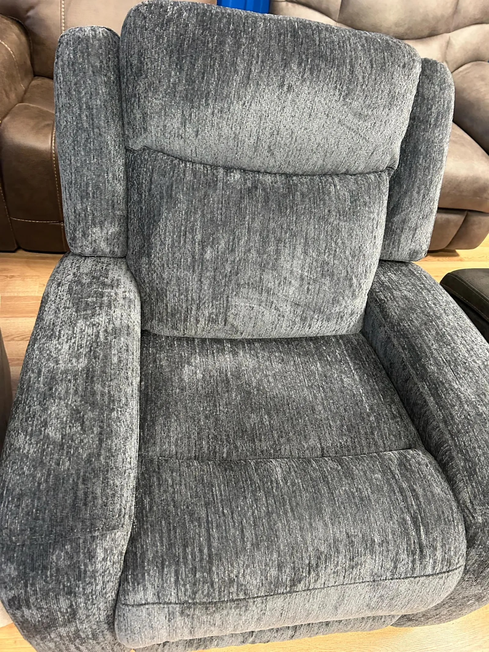 a grey chair with a grey cushion