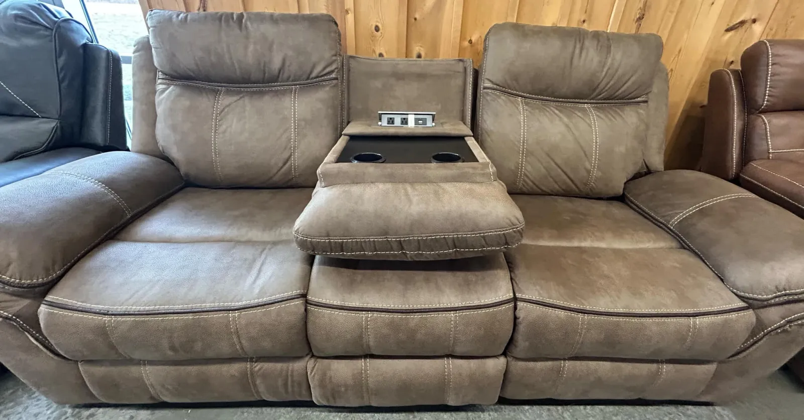 a couch with a laptop on it