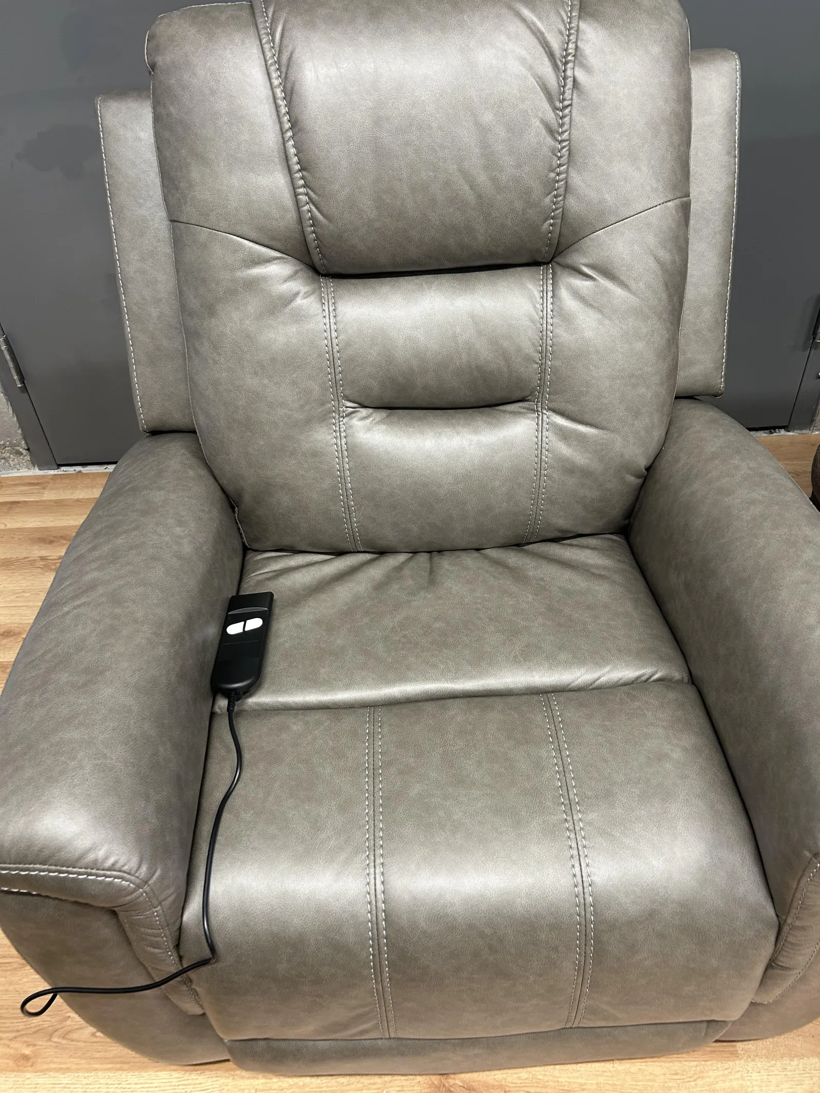 a leather chair with a remote control