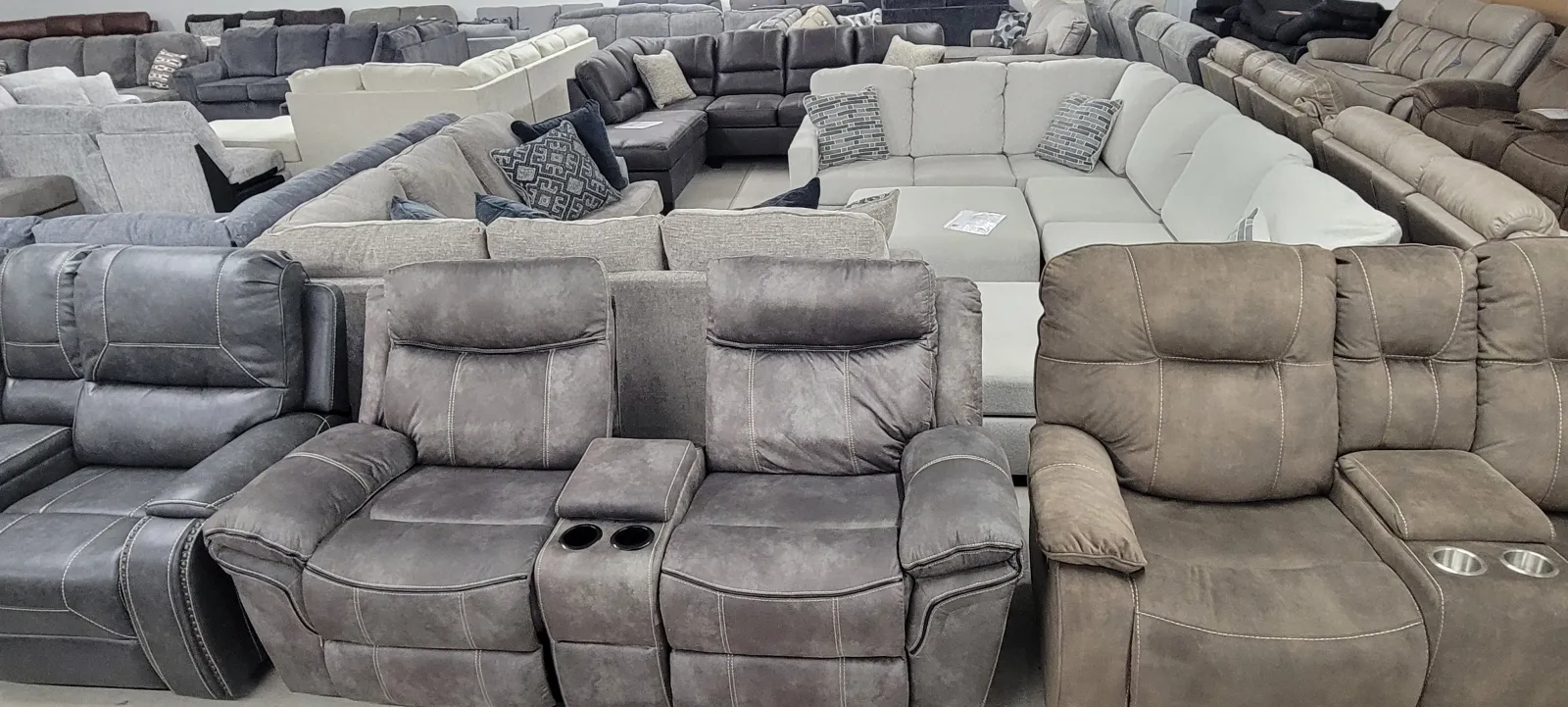 a large room with a couch and chairs