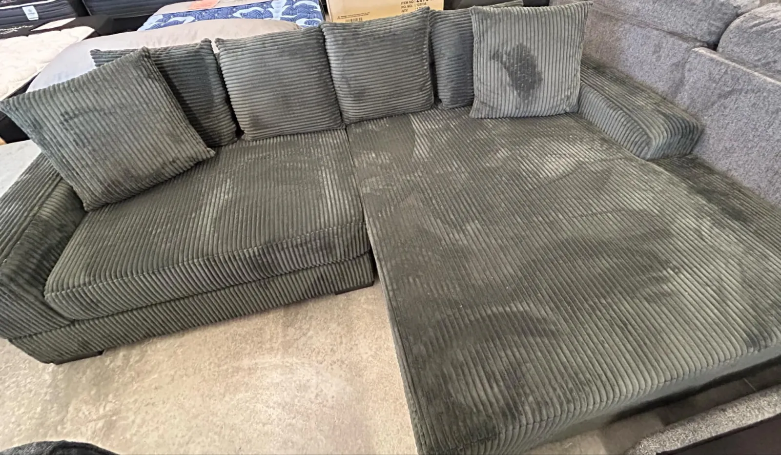 a group of grey couches