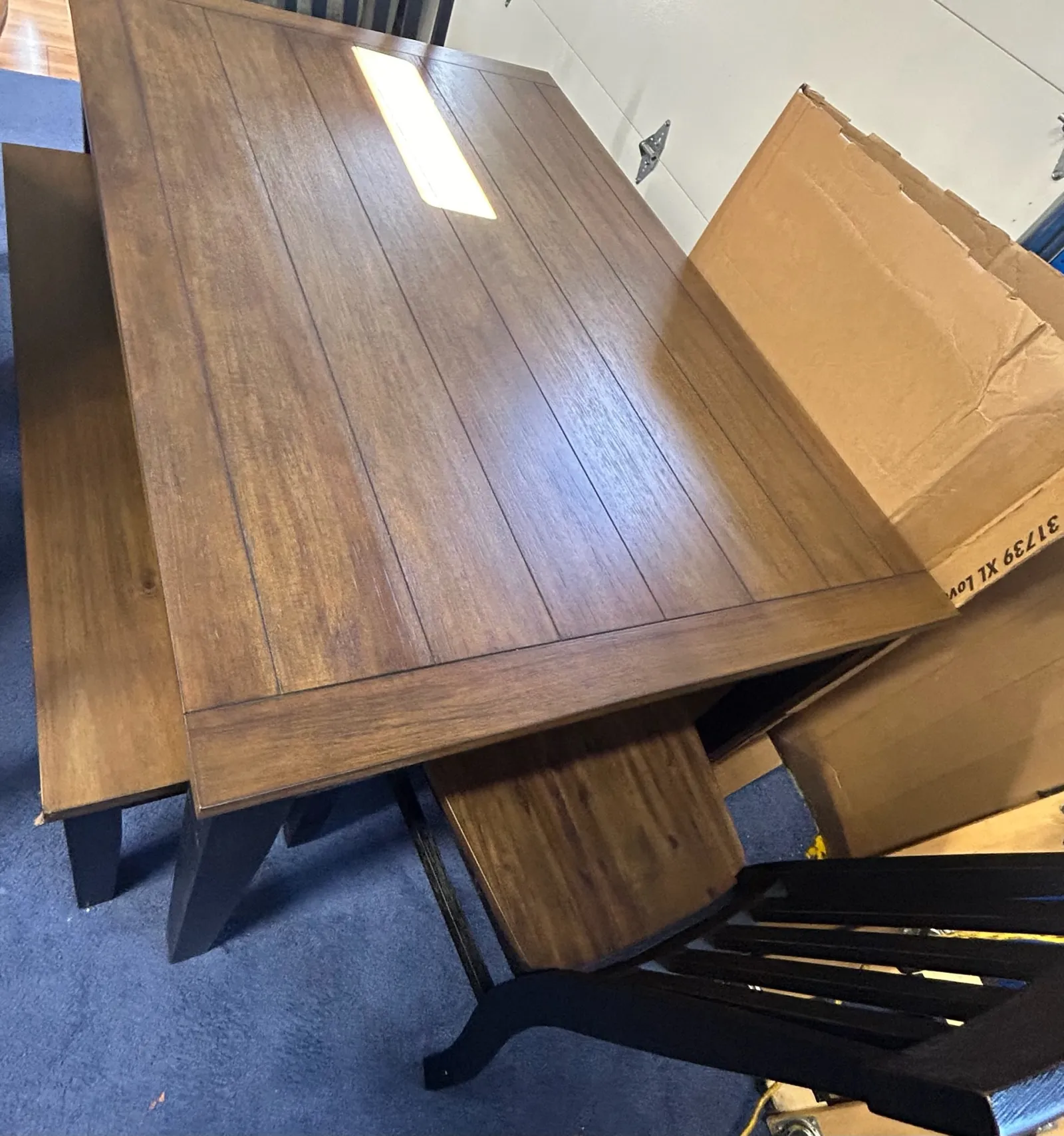 a wooden table with a box on top