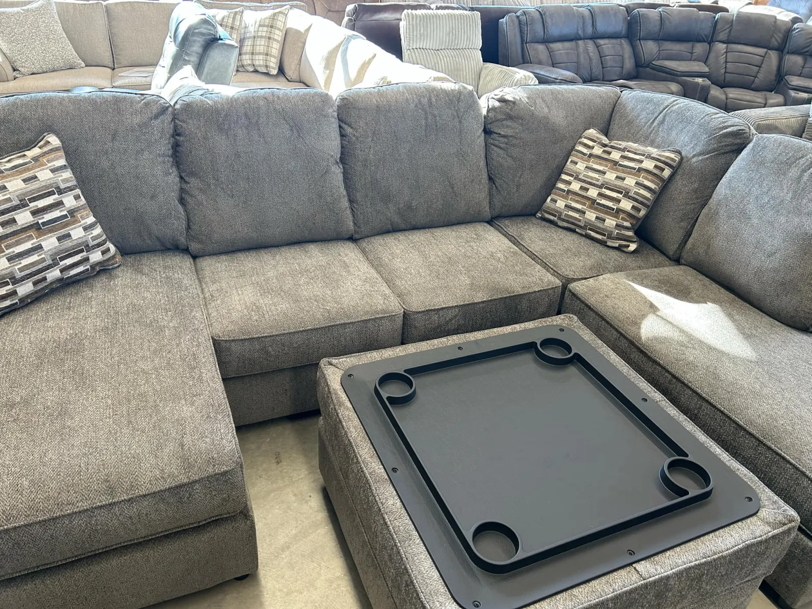 a black rectangular device on a grey couch