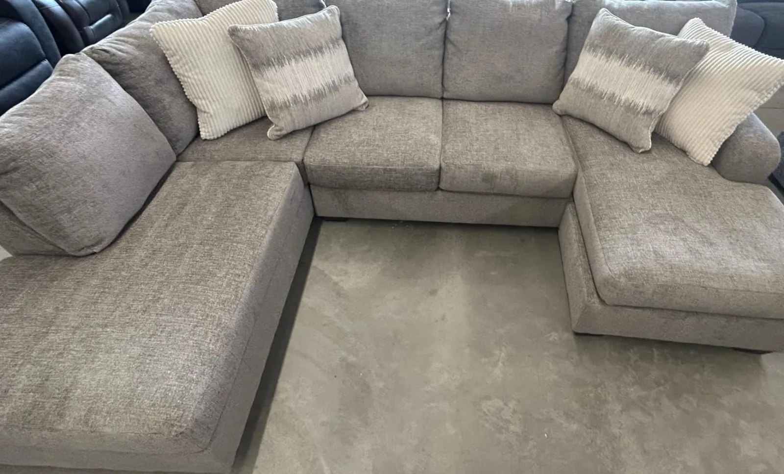 a group of grey couches