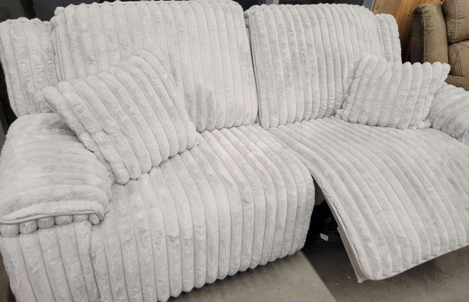 a couch with white cushions