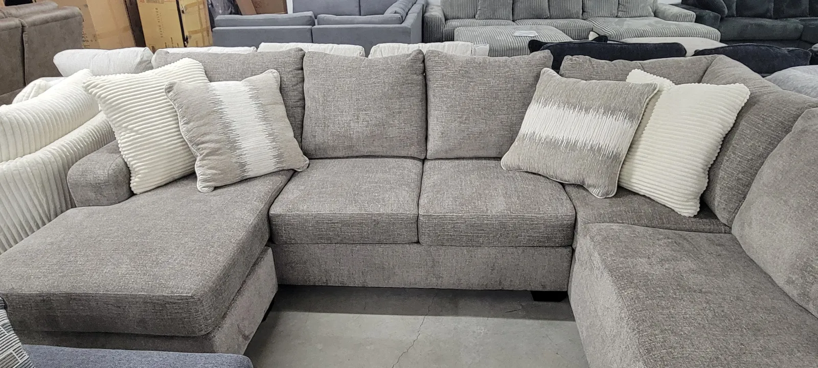 a group of grey couches