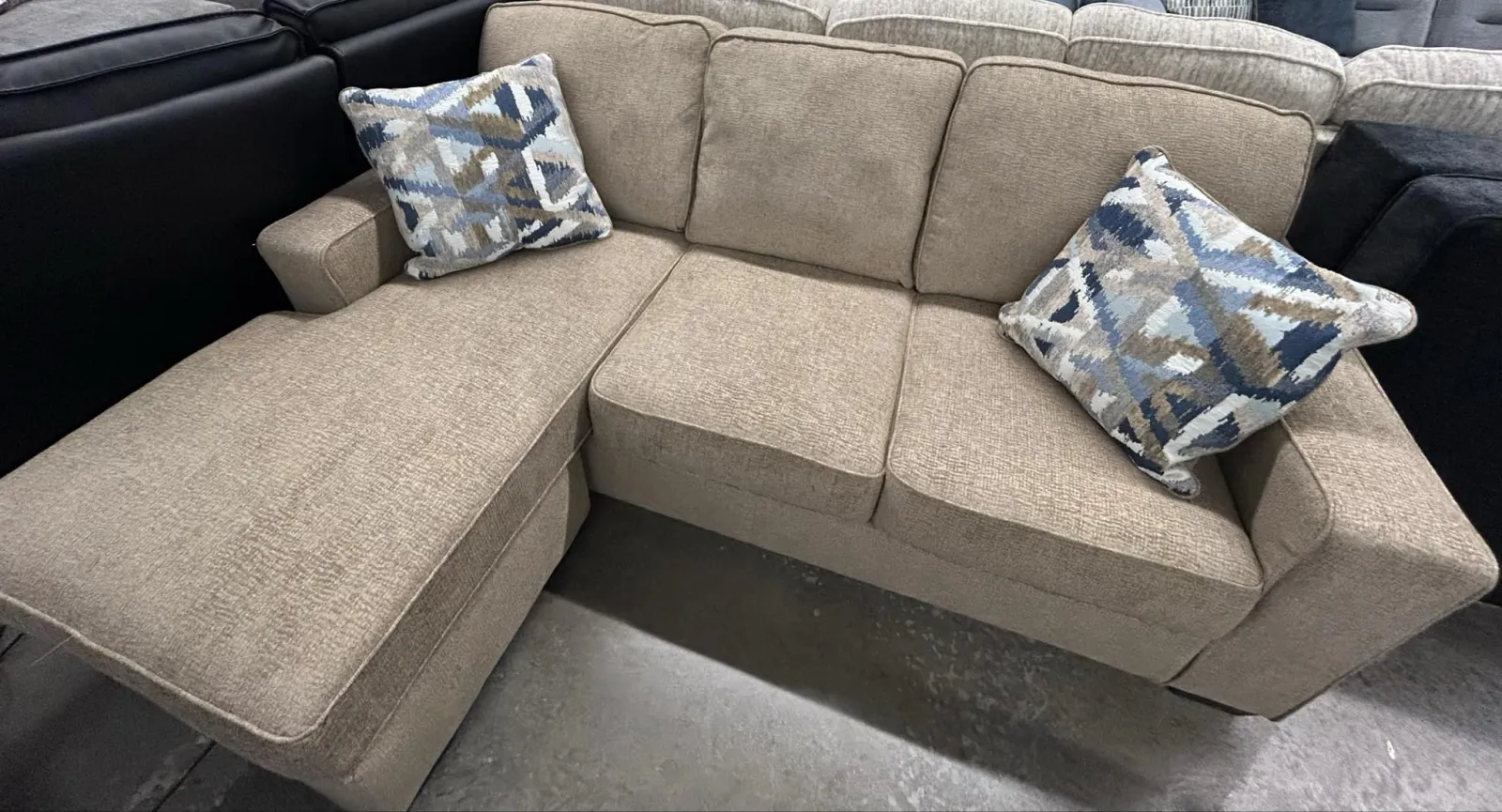 a group of grey couches