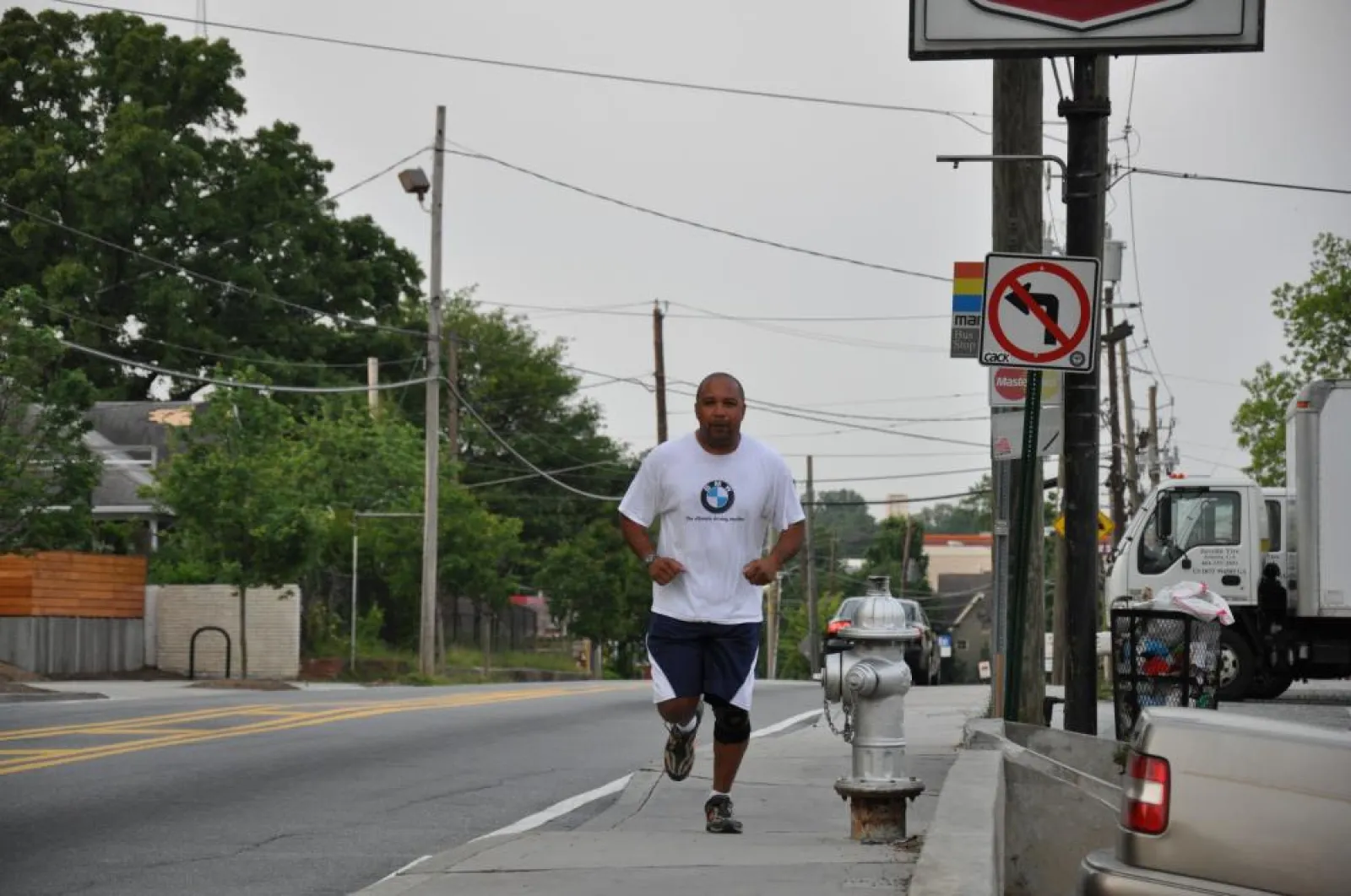 Steve running on the sidewalk