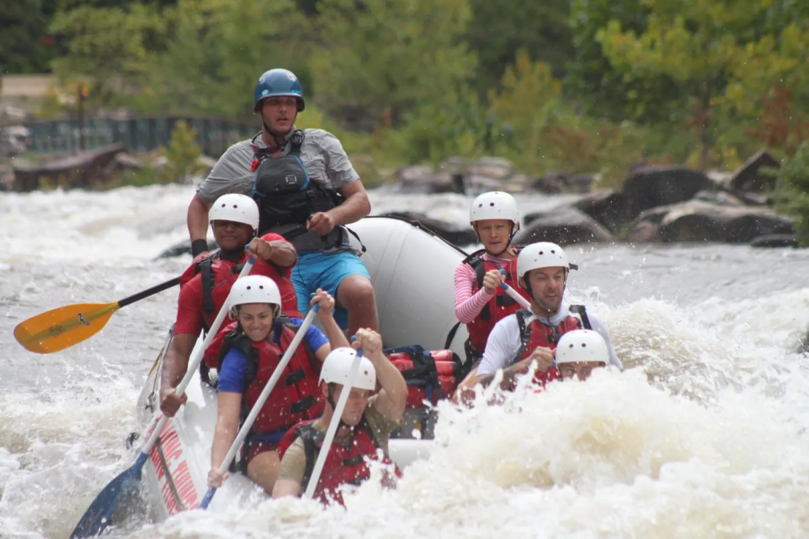 a group of people riding on a raft