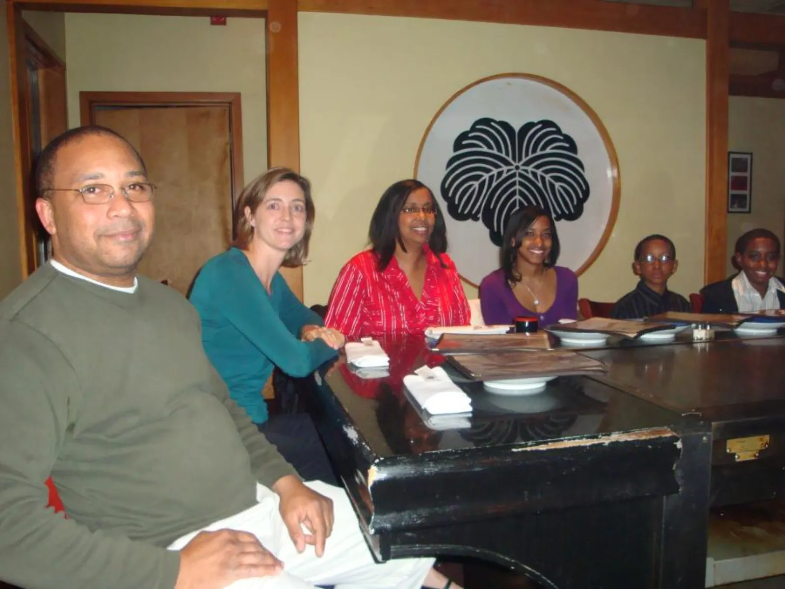 a group of people sitting at a table