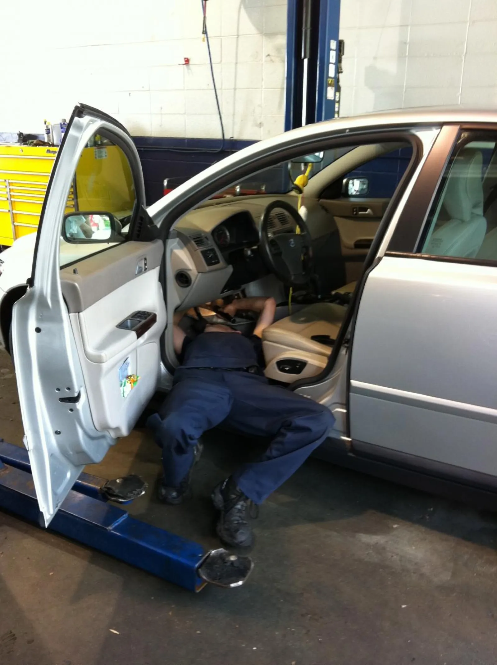 a man working inside of a car