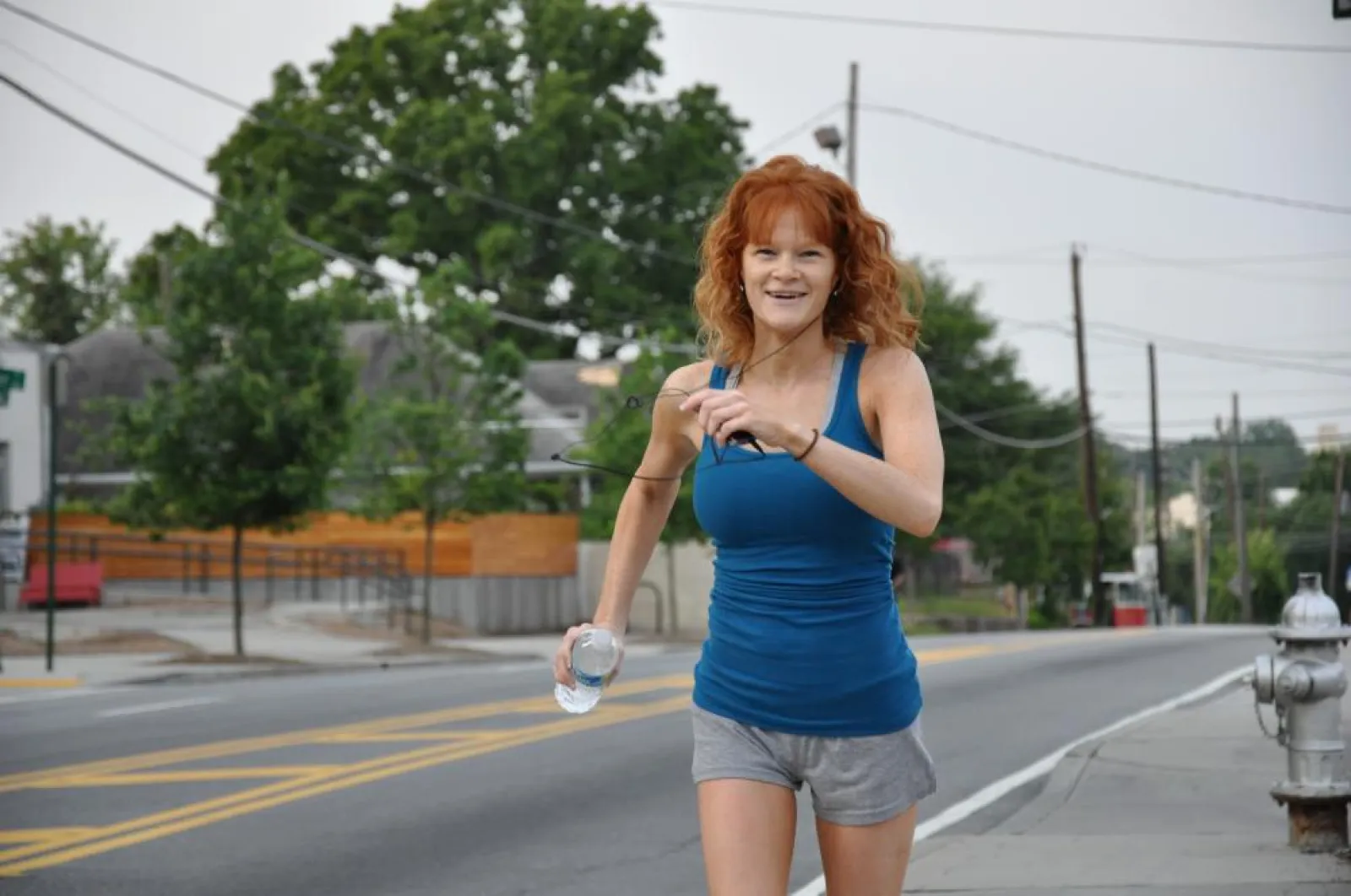 Jessi running on the sidewalk