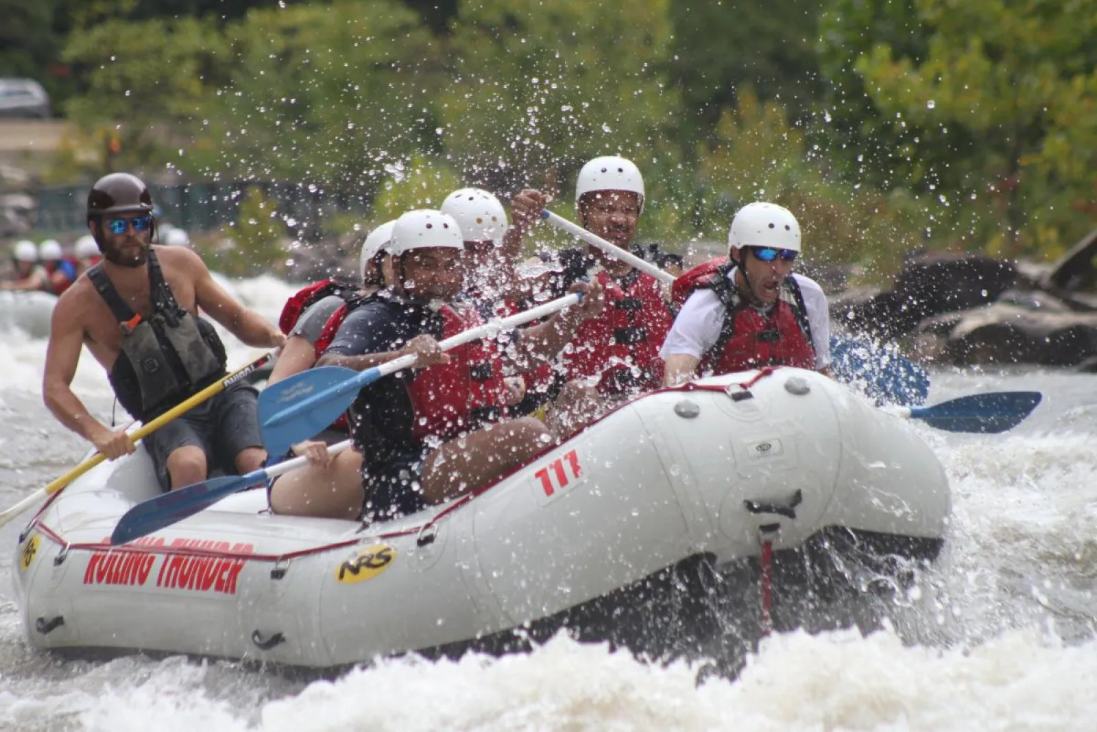 a group of people riding a raft