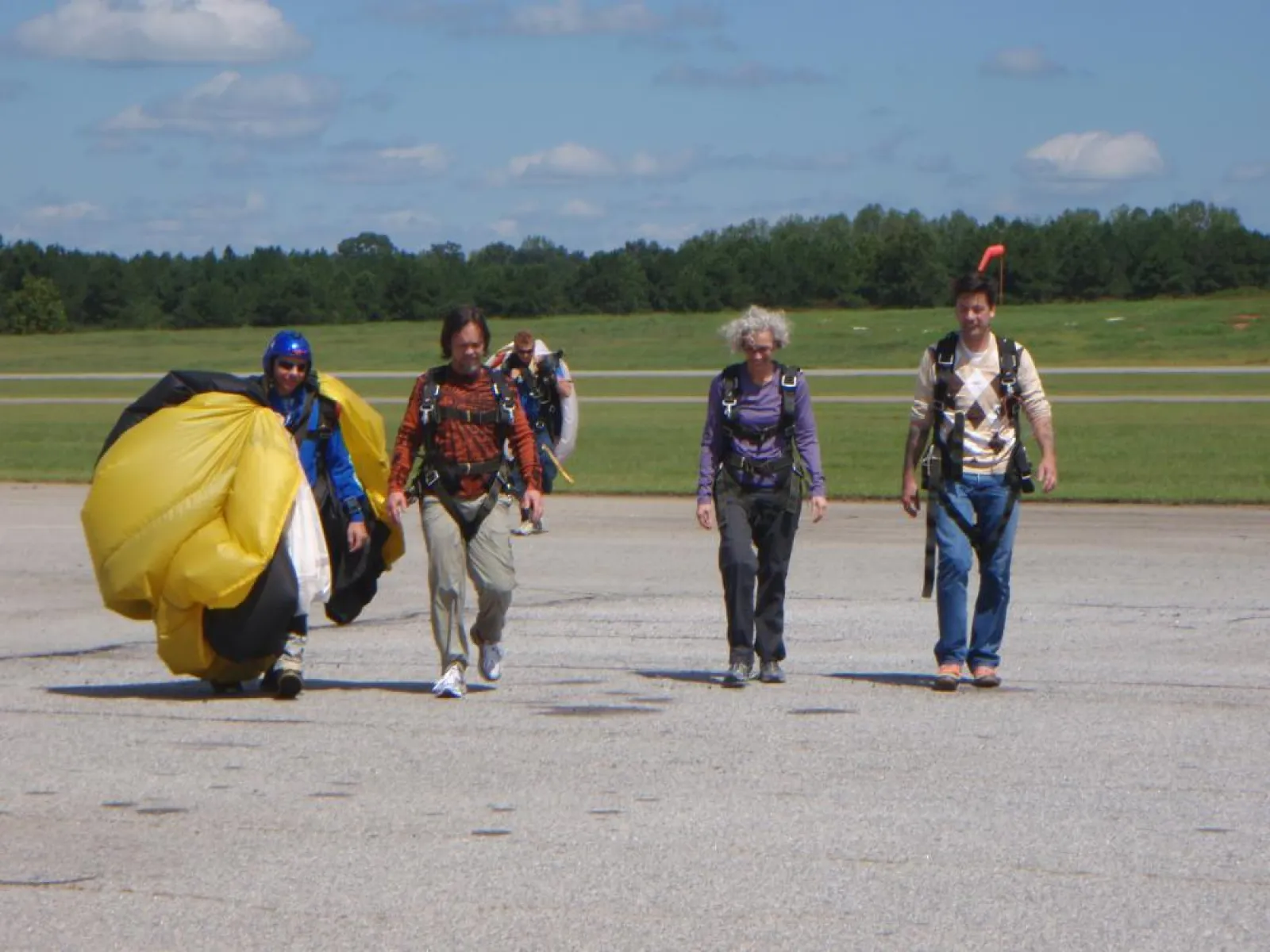 people walking back from sky diving