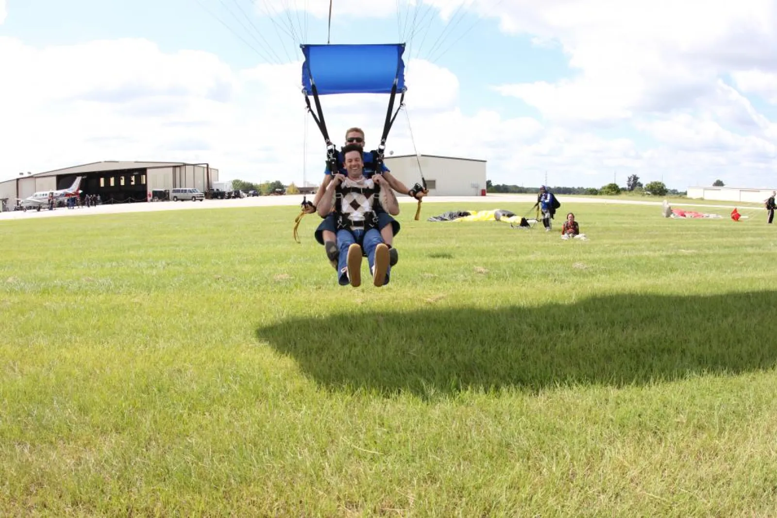 a group of people landing after sky diving