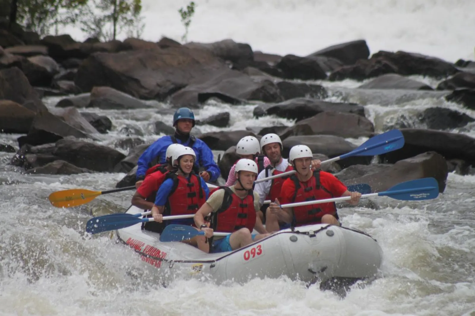 a group of people on a raft in a body of water