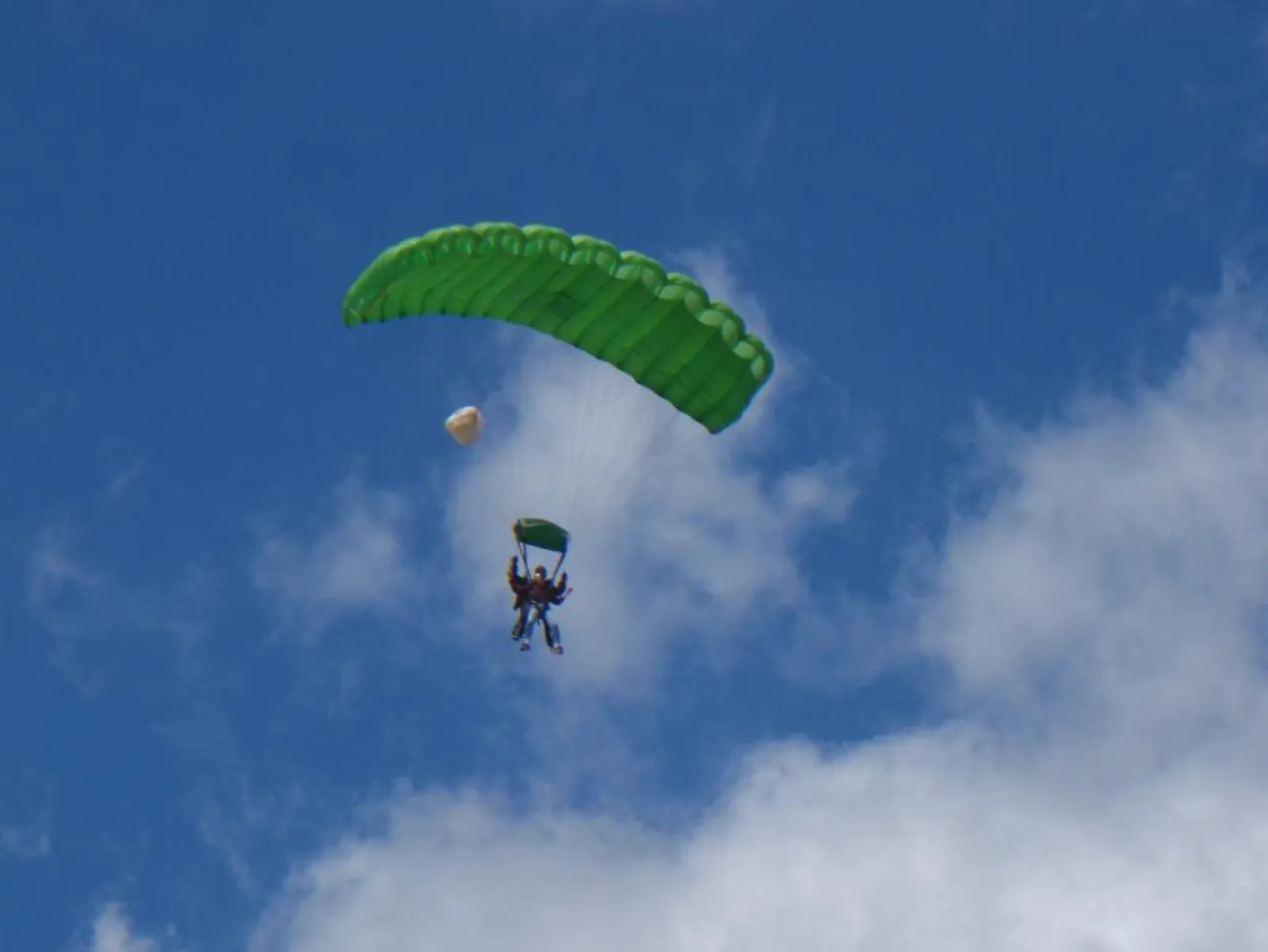 people under a parachute