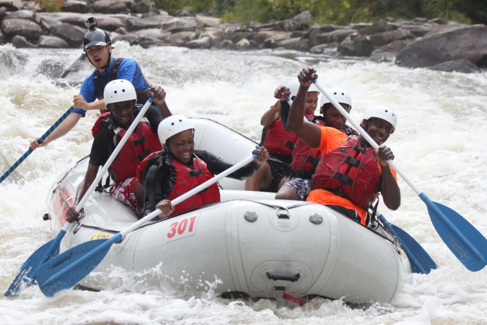 a group of people on a raft