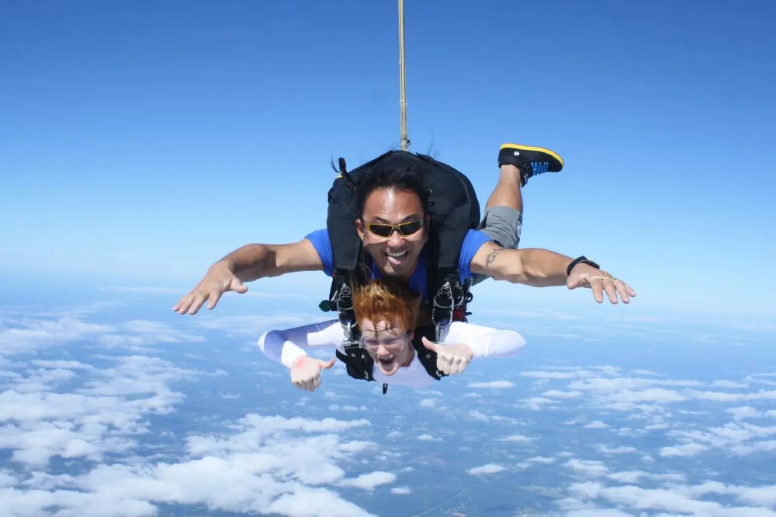 two people jumping out of a plane