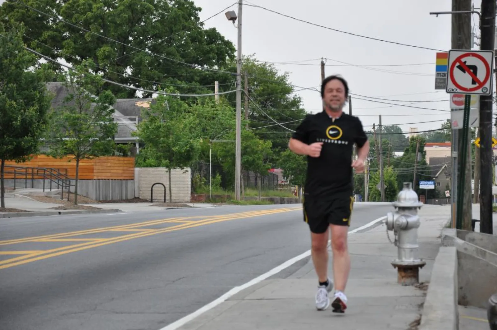 Craig running on a sidewalk